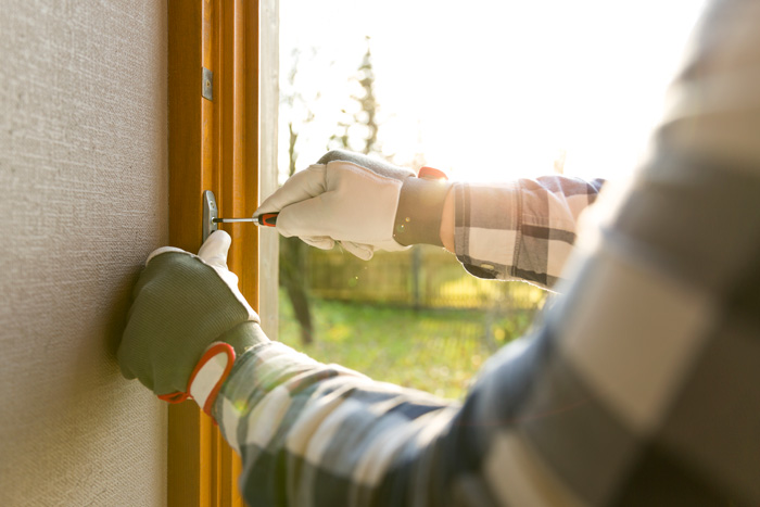close up of man installing window
