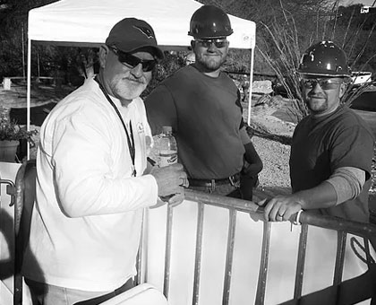Apex Window owners pose for photo together while on a worksite