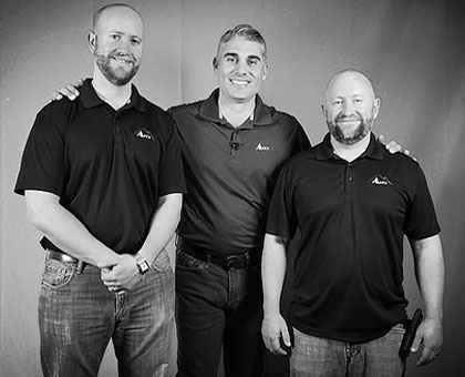 three new owners of apex windows pose for a photo together